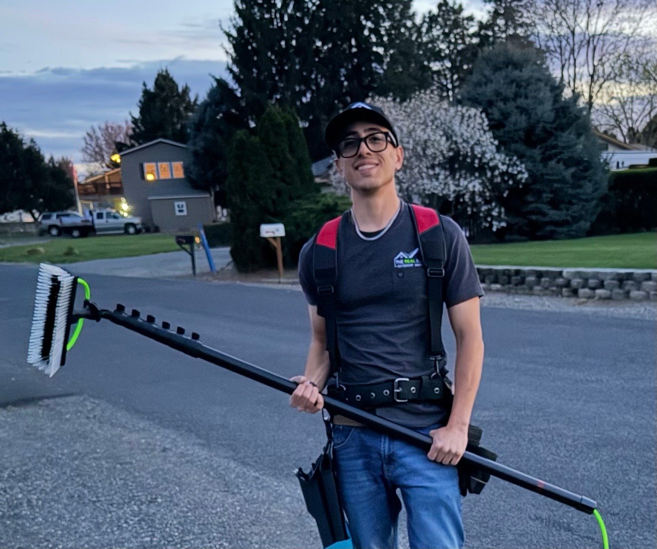 Elijah with professional window cleaning equipment